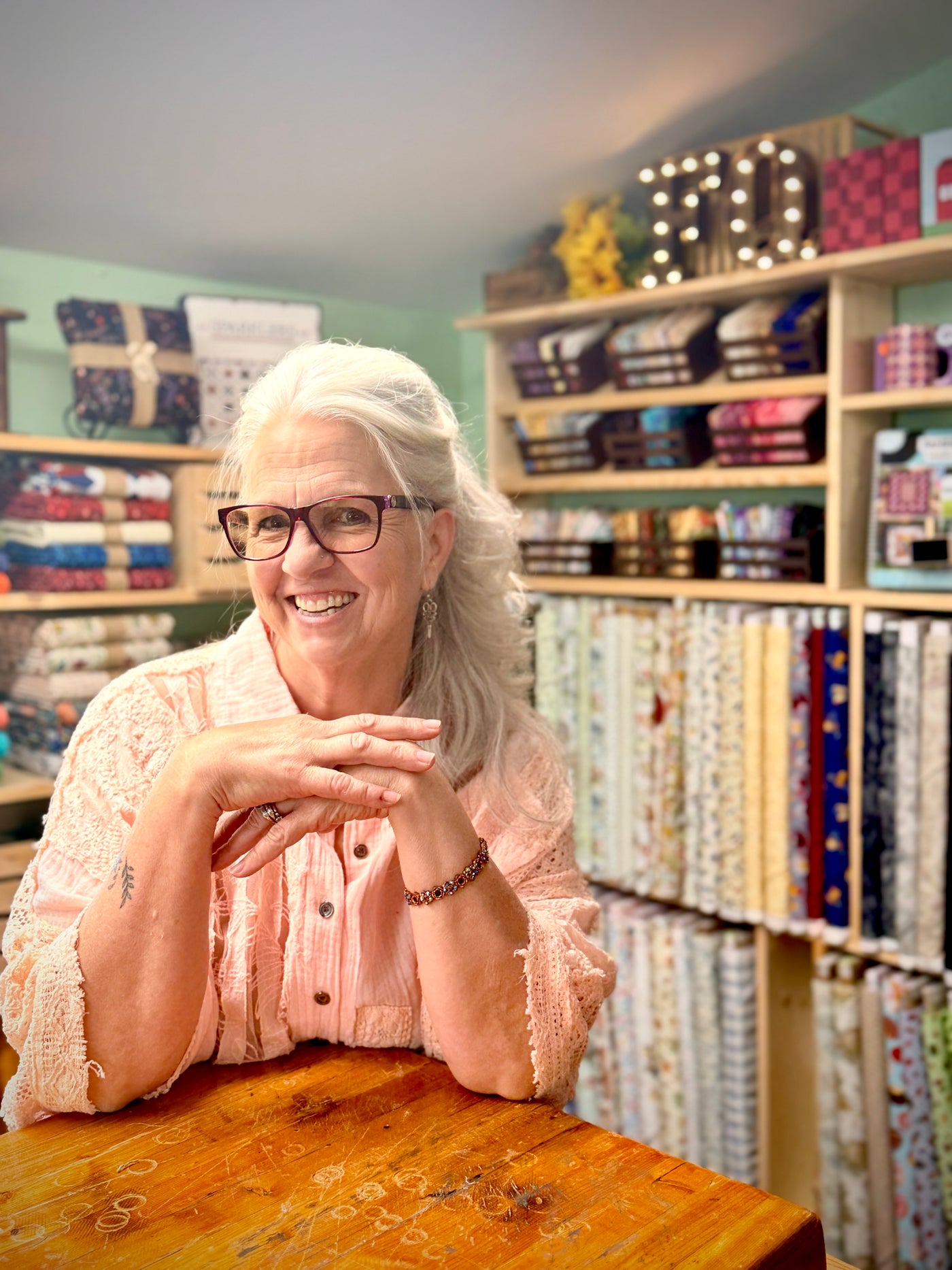 Friendly Frontier Quilting staff member in the shop